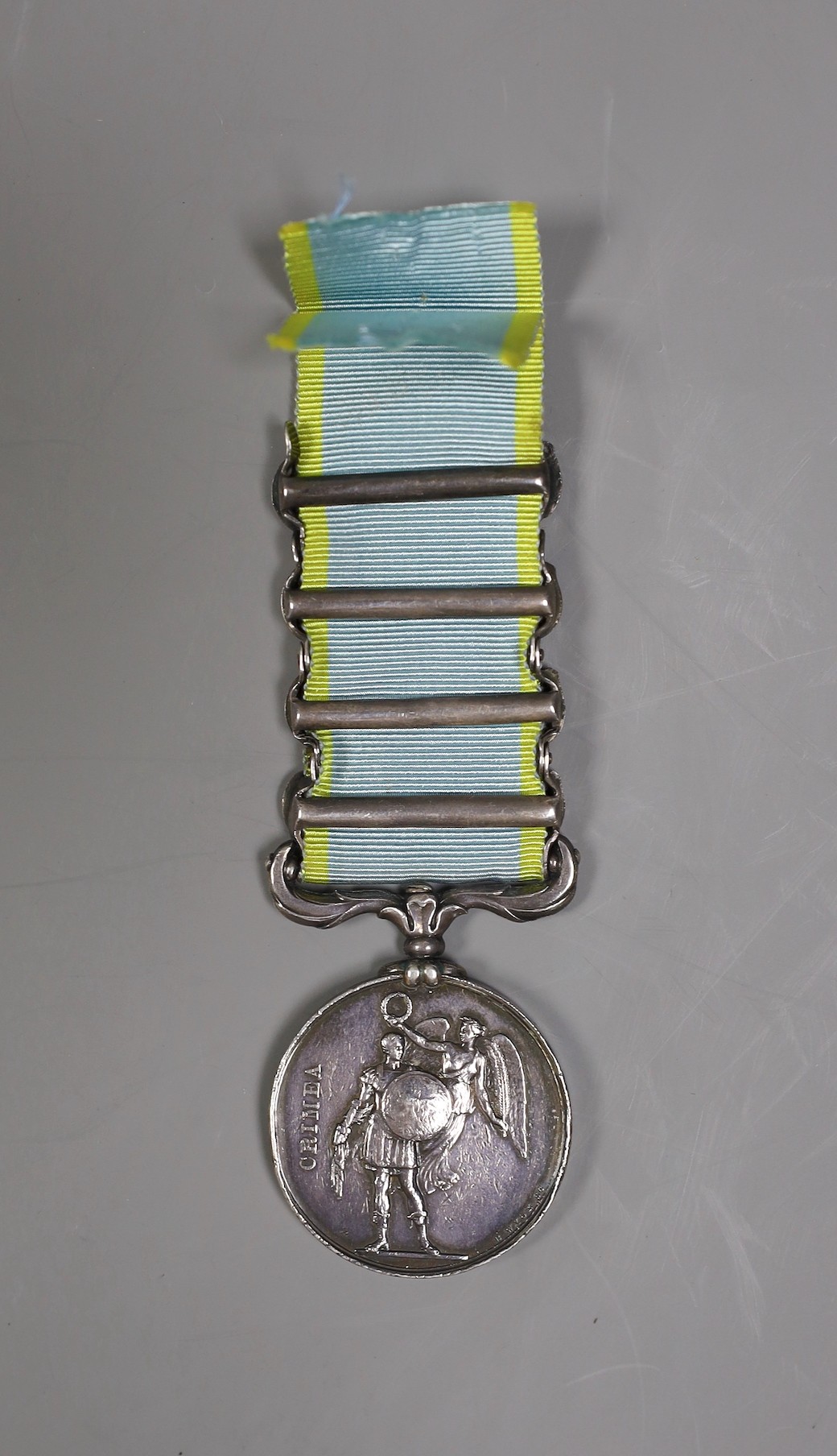 A Crimea war medal with 4 clasps - ‘Sebastopol’, ‘Inkermann’, ‘Balaklava’ and ‘Alma’ stamped 3722 GDS readable to rim